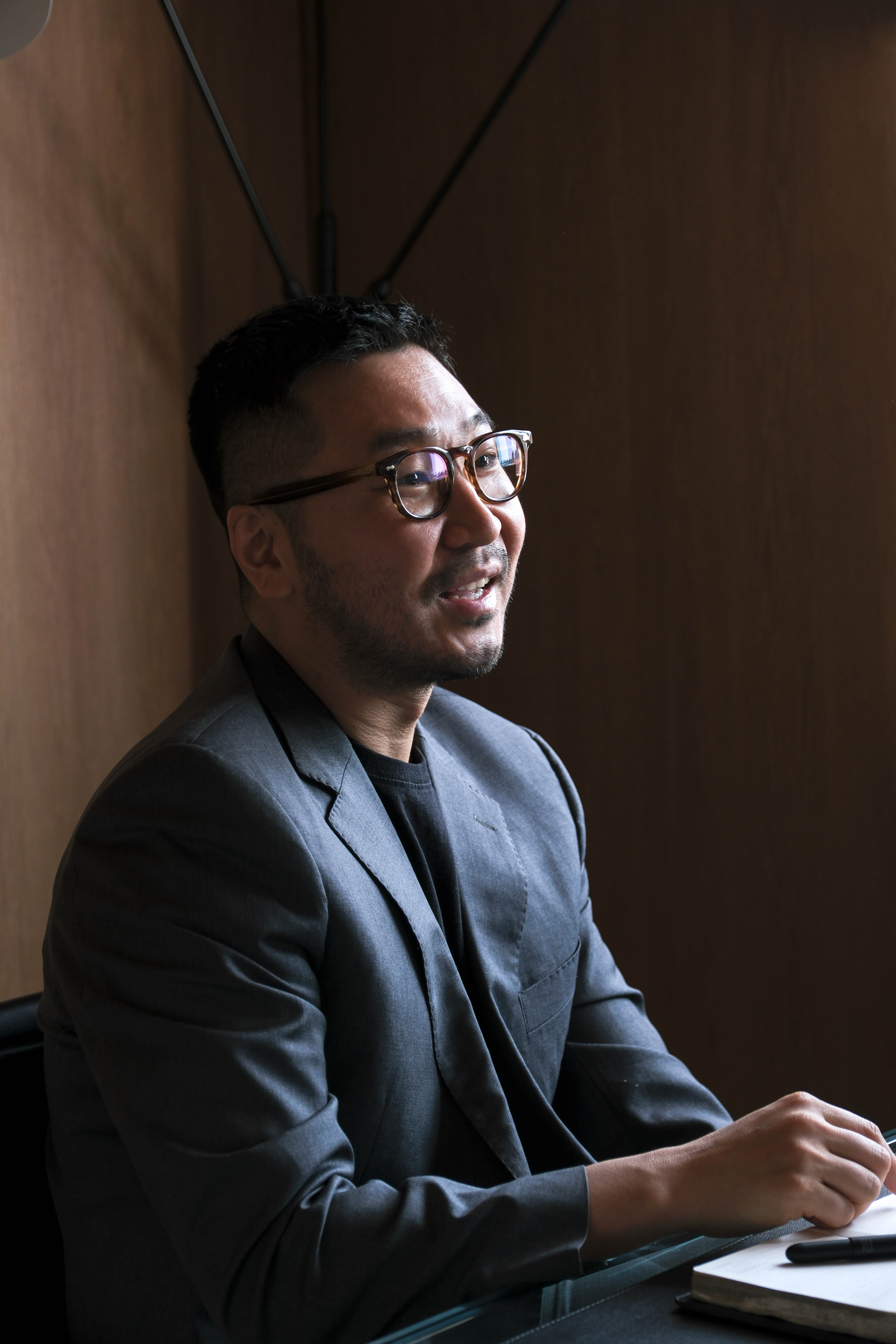 Portrait of Kim Dong-hyun of Maha Architects speaking inside Maha Hannam